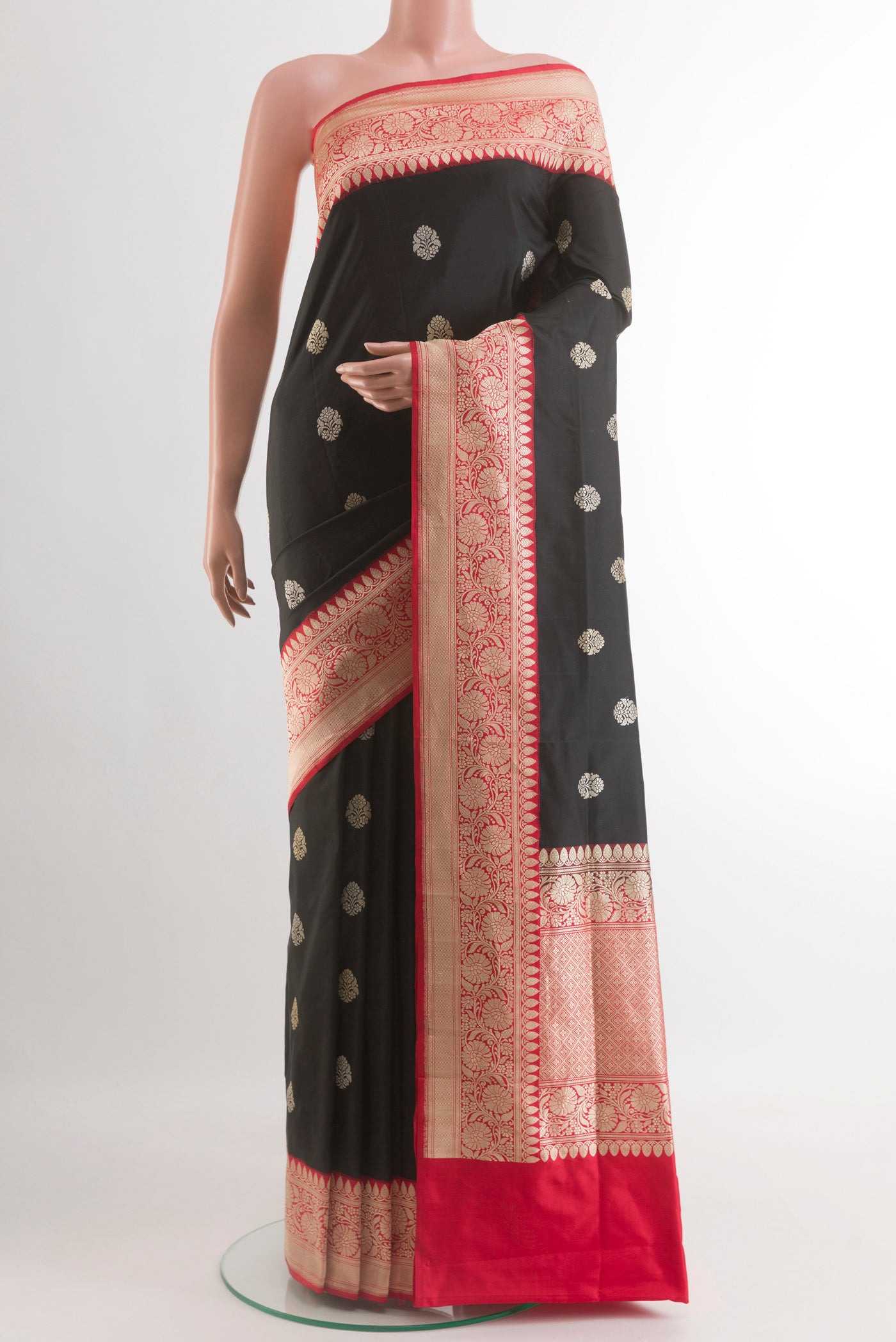 Black Banarasi Silk Saree with Zari Butta on the body and Zari Border.  displayed on a mannequin