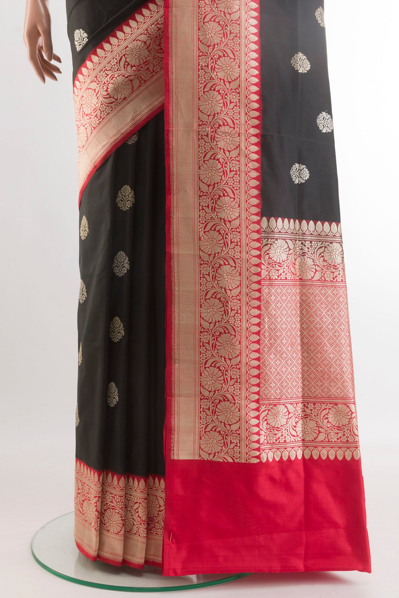 Pleats and pallu of Black Banarasi Silk Saree with Zari Butta on the body and Zari Border. 