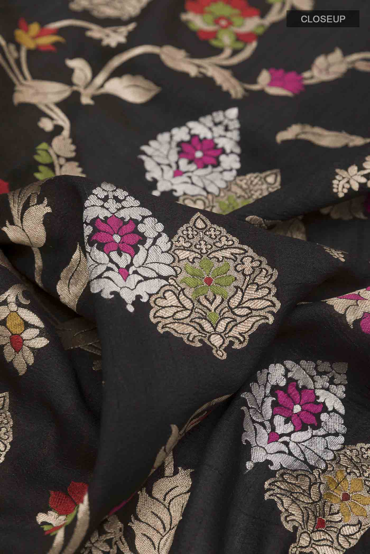 Close up of Black Banarasi Tussar Silk Saree with Zari Brocade on the body and Zari Border displaying folds