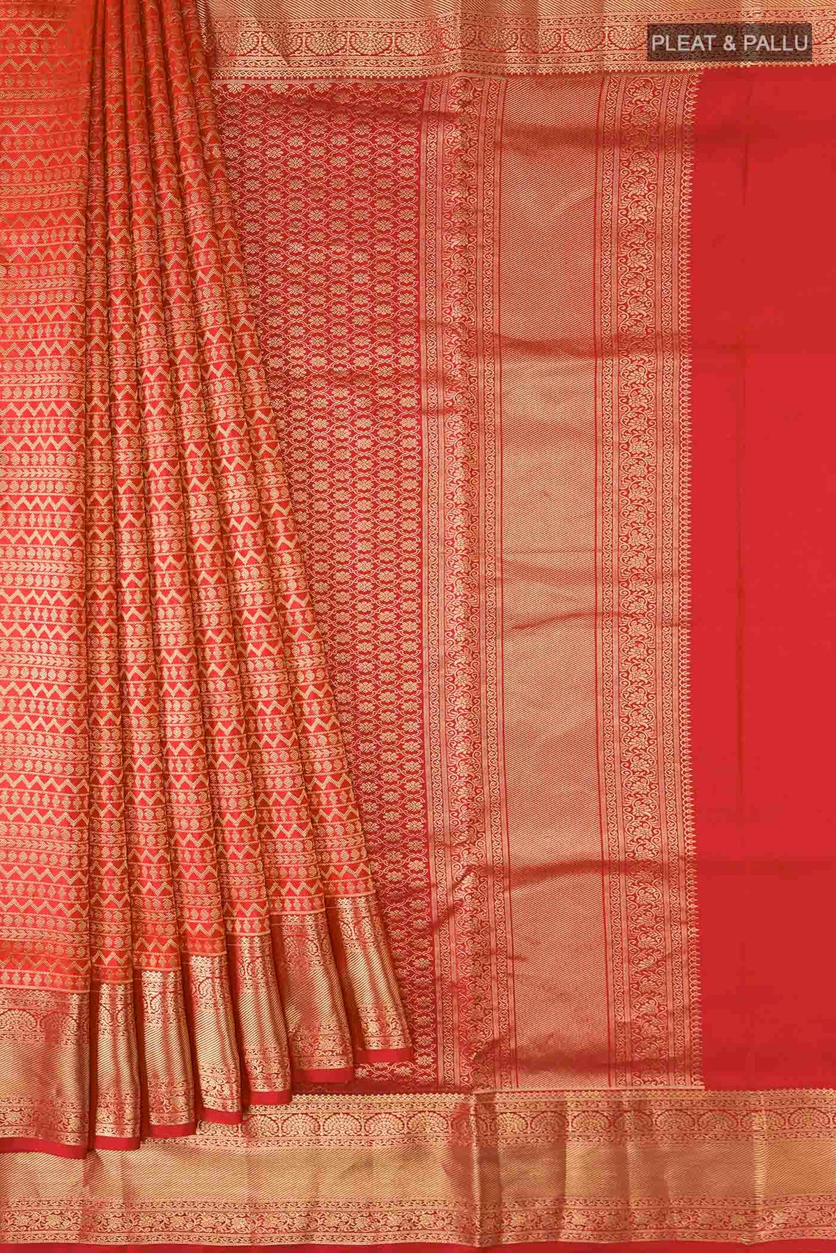 Pleats and pallu of Red Soft Silk Saree with Stripes on the body and Zari Border