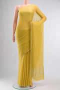 Yellow Mysore Chiffon Saree with Embroidery on the body and Zari Border displayed on a mannequin