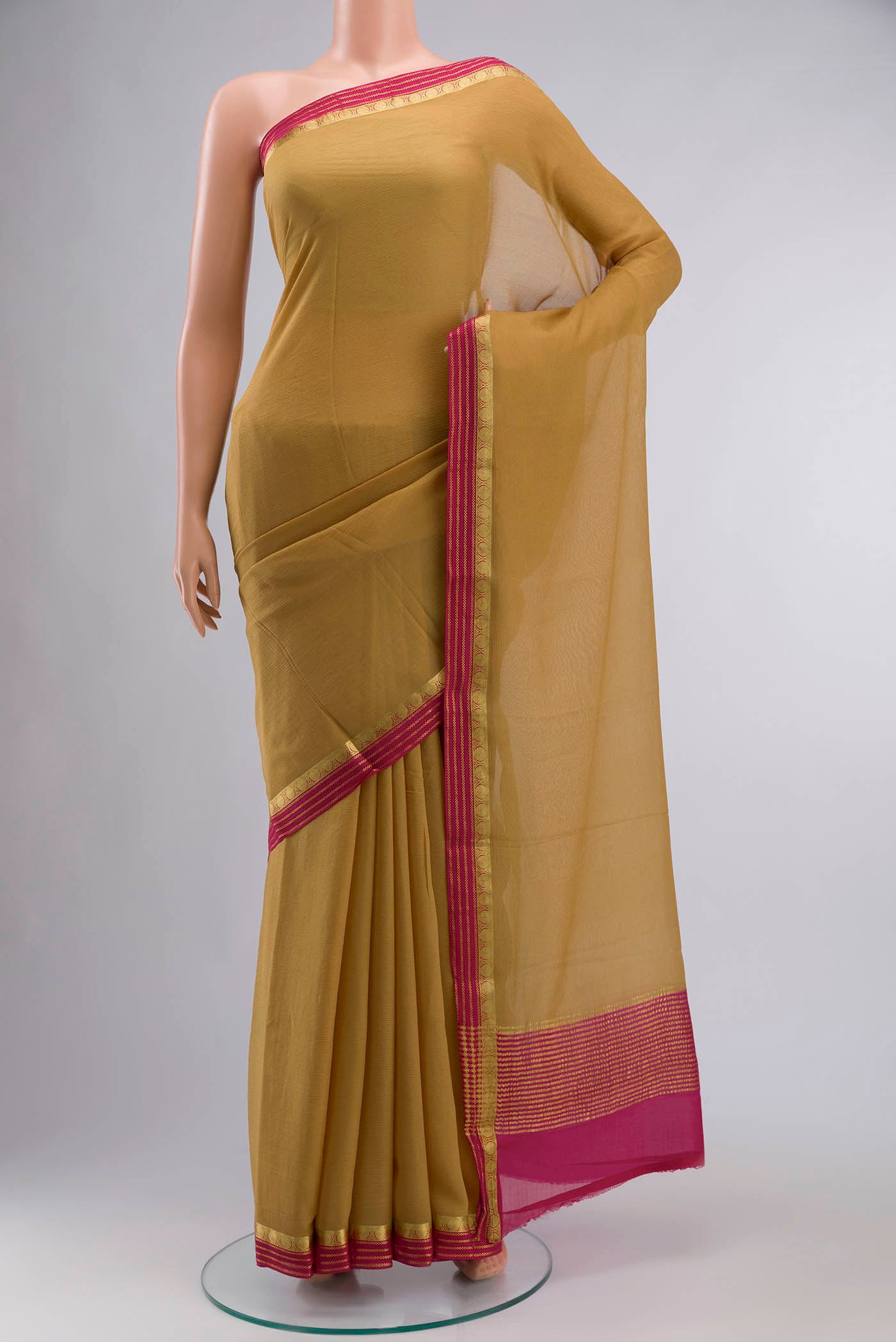 Brown Mysore Chiffon Saree with Plain Body and Zari Border displayed on a mannequin