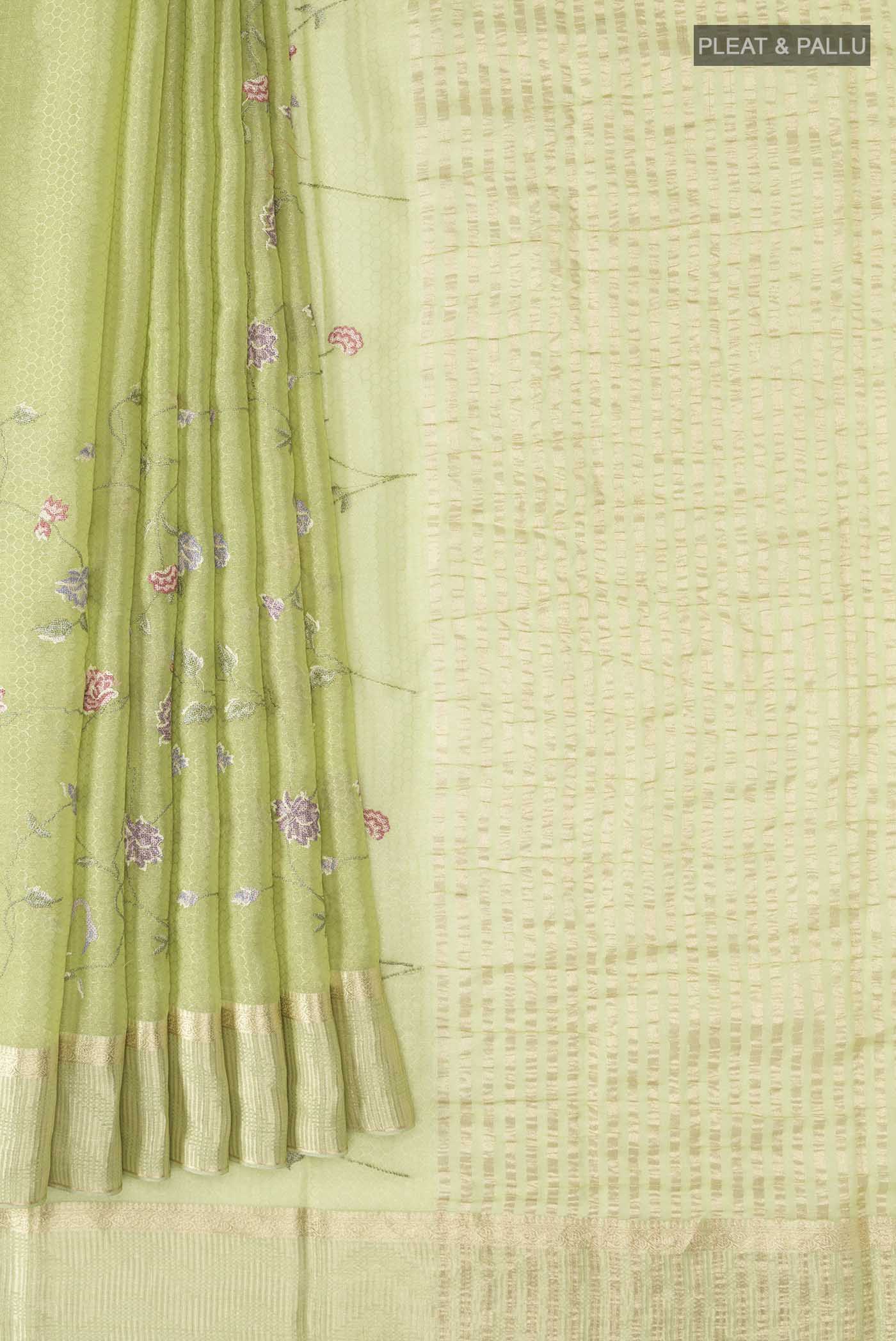 Pleats and pallu of Green Mysore Georgette Saree with Embroidery on the body and Zari Border