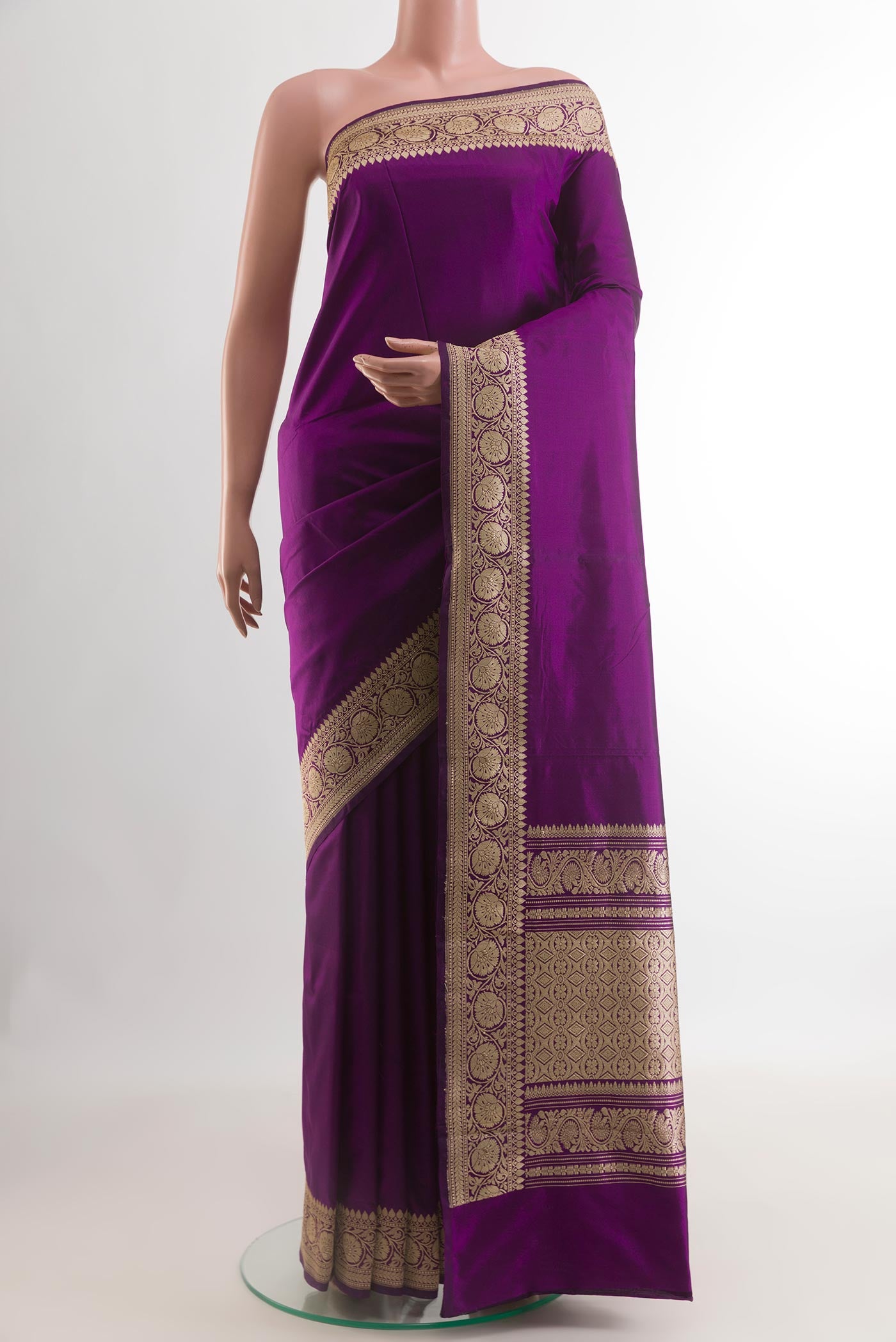 Purple Banarasi Katan Silk Saree with Plain Body and Zari Border.  displayed on a mannequin