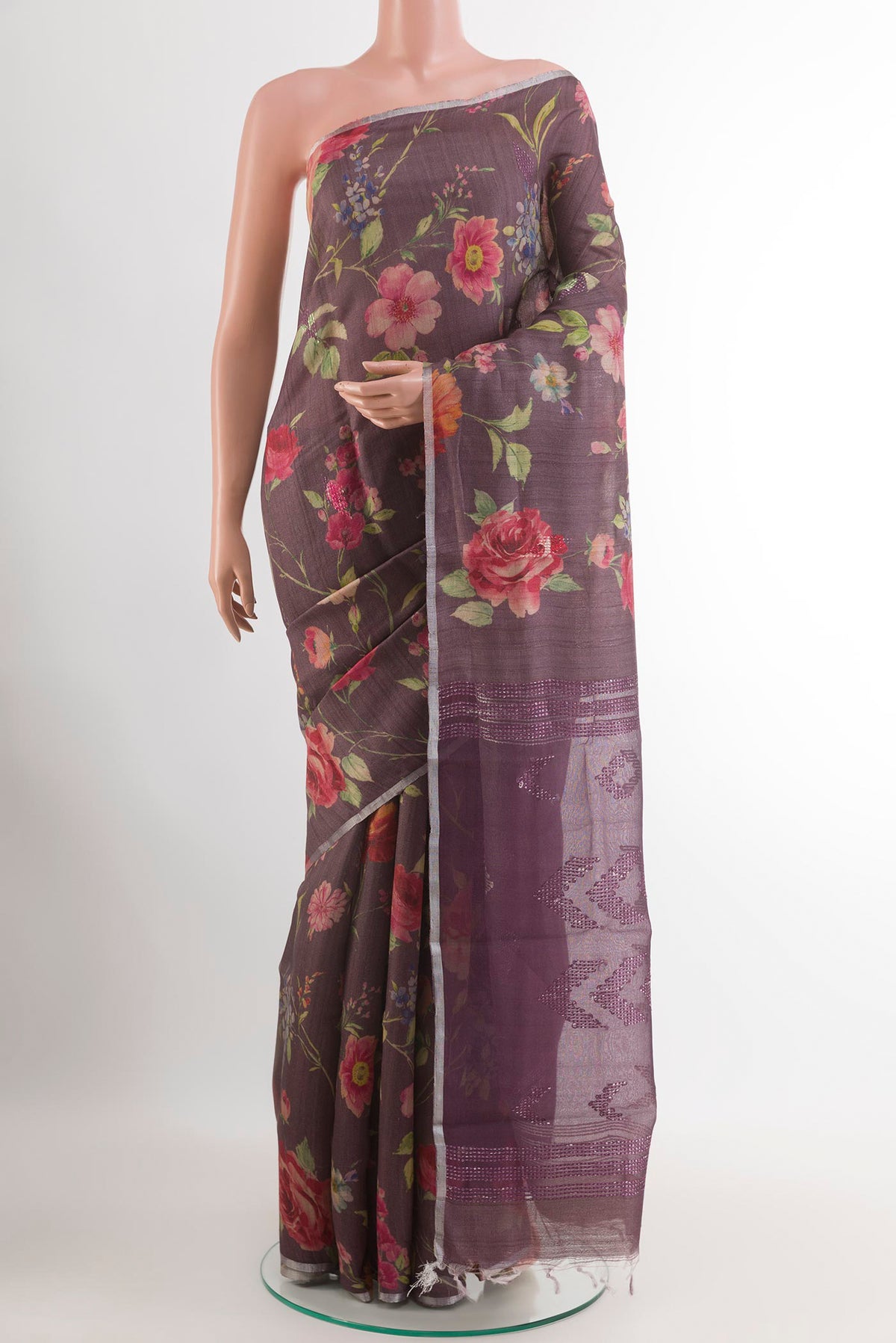 Purple Tussar Saree with Printed design on the body and Zari Border.  displayed on a mannequin