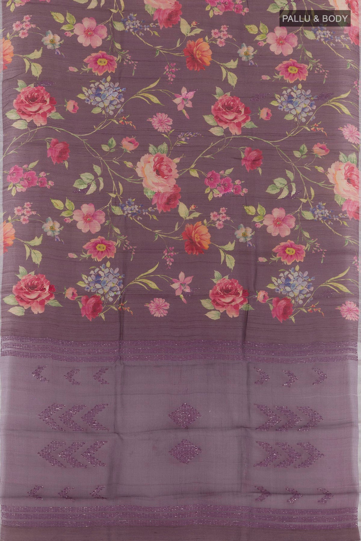 Flat view of Purple Tussar Saree with Printed design on the body and Zari Border. 