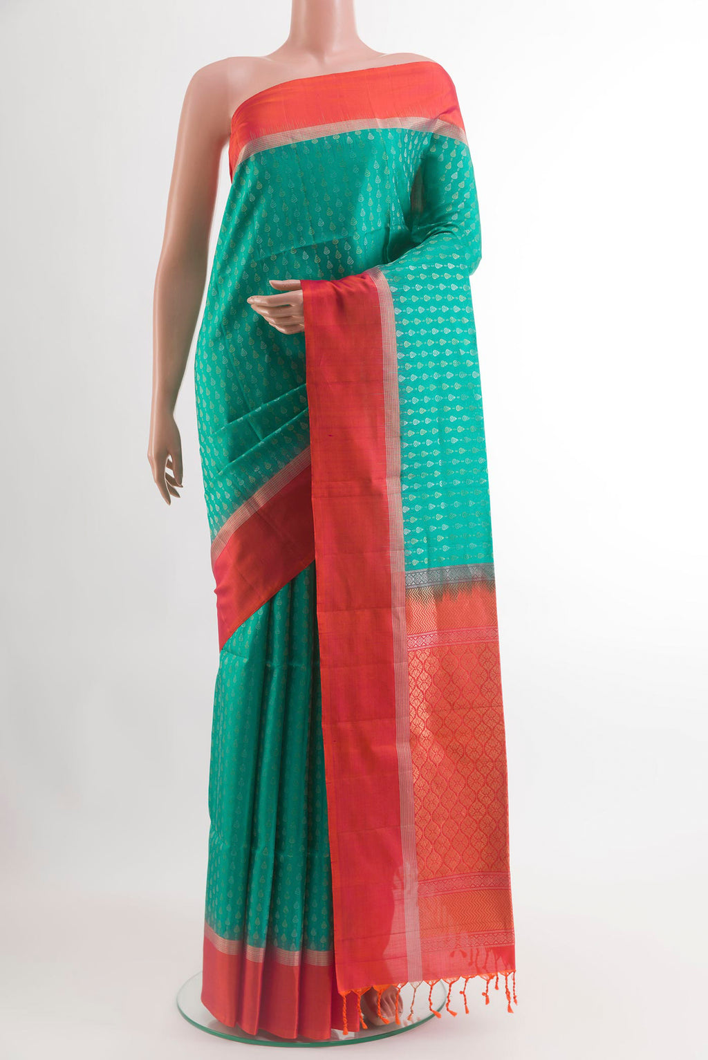Sea Green Soft Silk Saree with Zari Butta on the body and Zari Border.  displayed on a mannequin