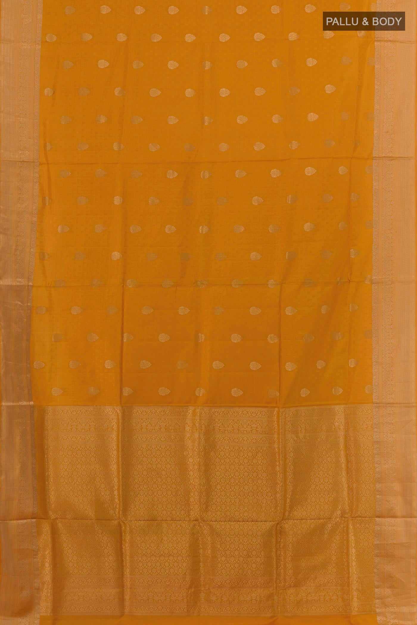 Flat view of Mustard Soft Silk Saree with Jacquard With Zari Butta on the body and Zari Border. 