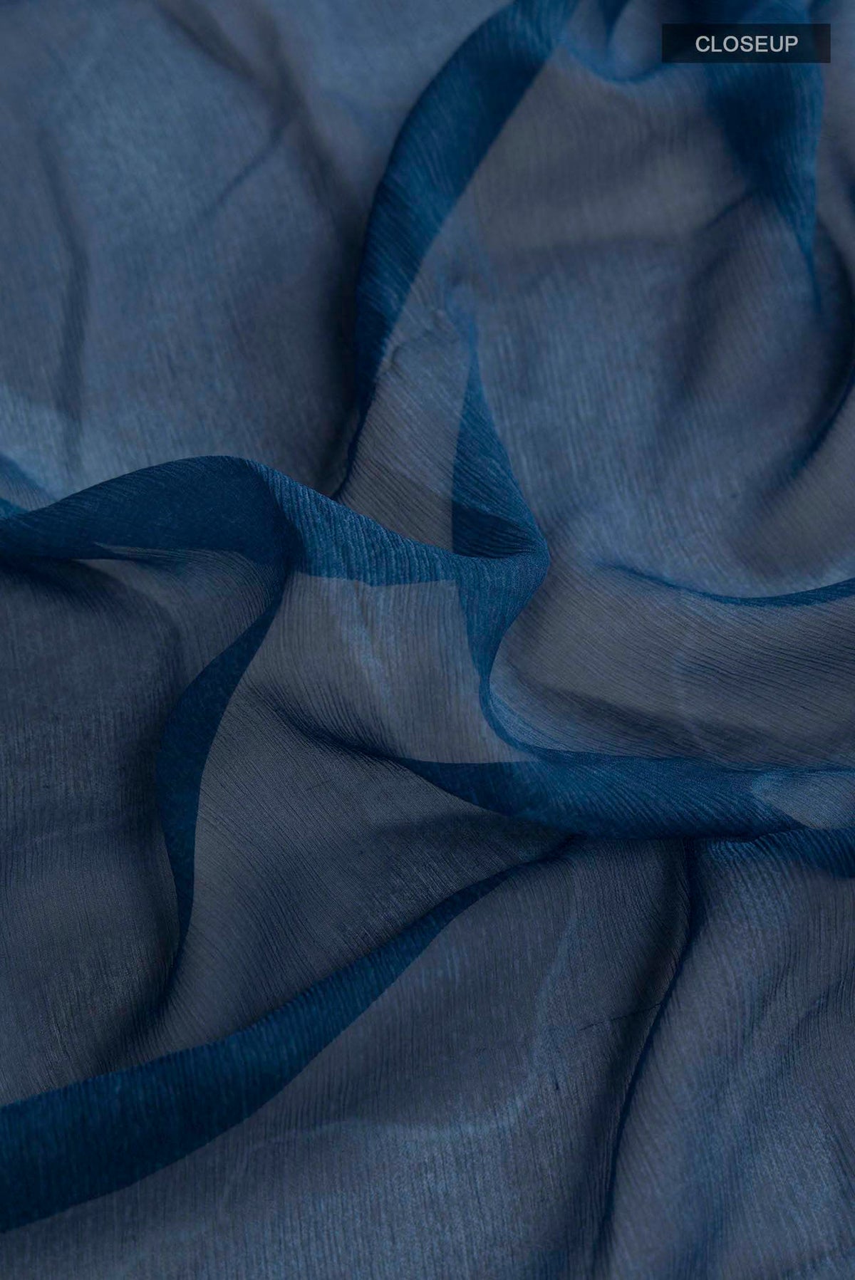 Close up of Multi Color Mysore Chiffon Saree with Plain Body and Plain Border displaying folds