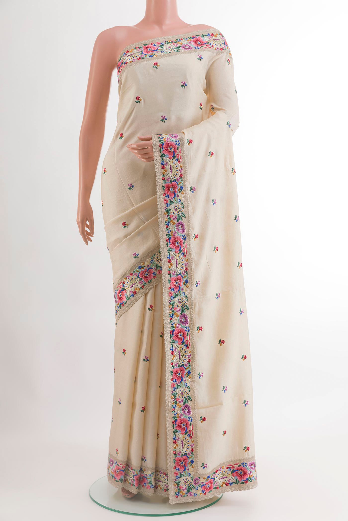 Off White Tussar Silk Saree with Embroidery on the body and Embroidery Border.  displayed on a mannequin