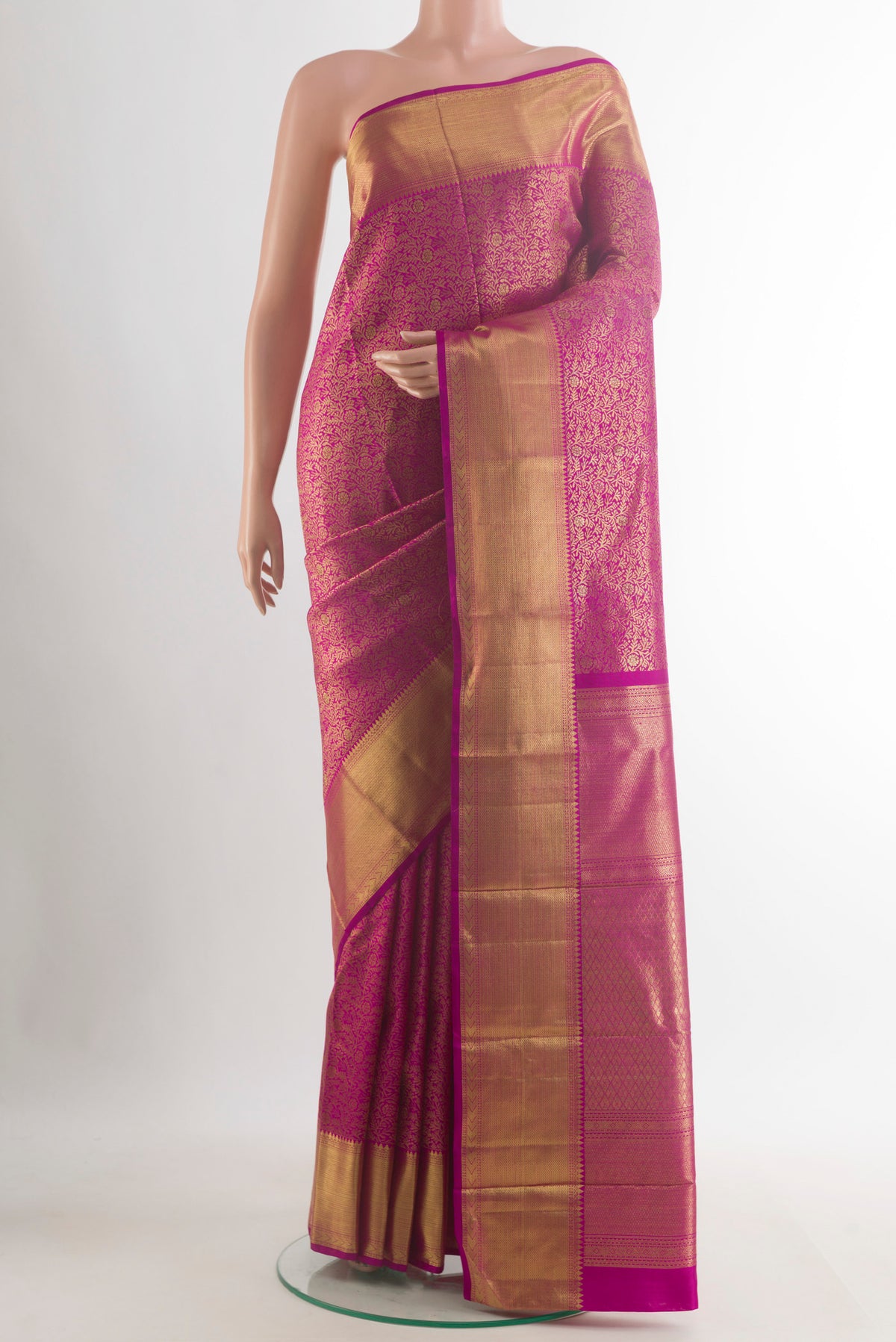 Pure Silk Pure Zari Magenta Kanjivaram Saree with Zari Brocade on the body and Zari Border.  displayed on a mannequin