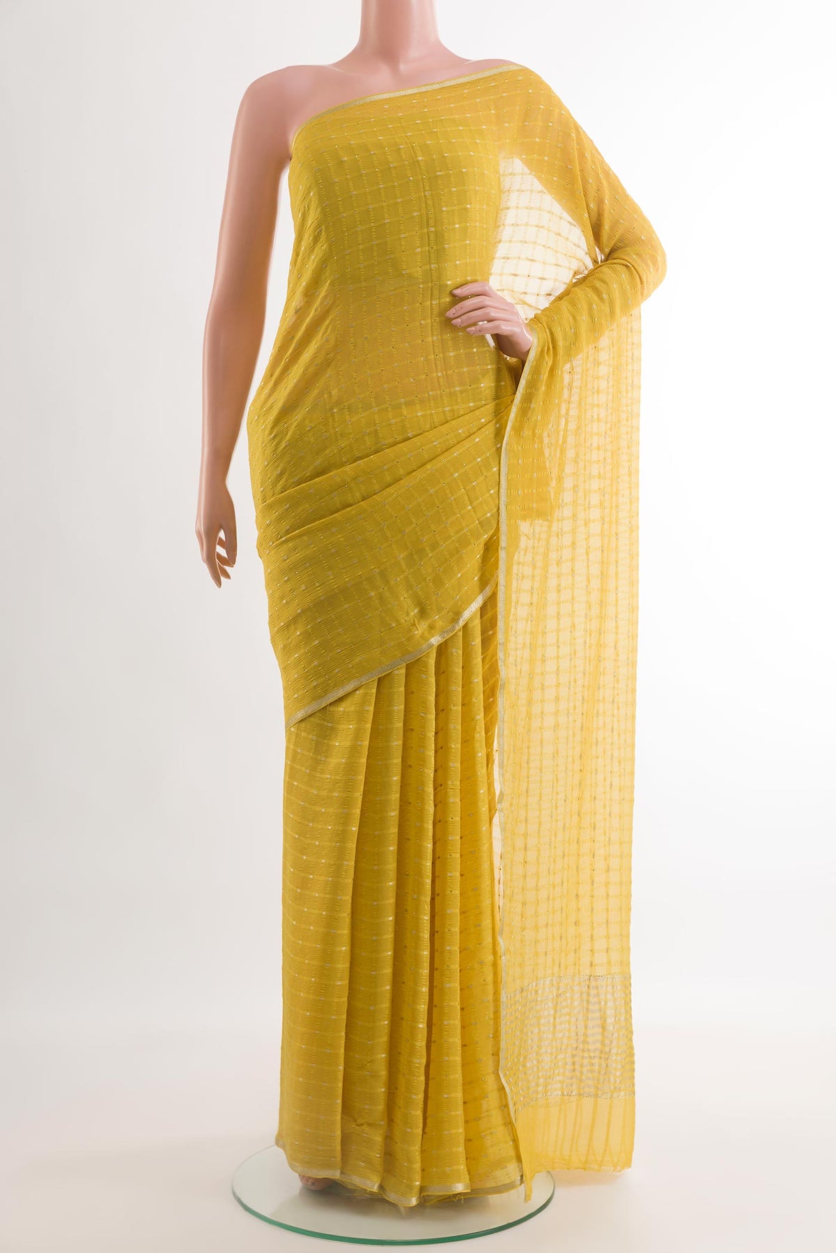 Yellow Mysore Chiffon Saree with Checked design on the body and Zari Border.  displayed on a mannequin