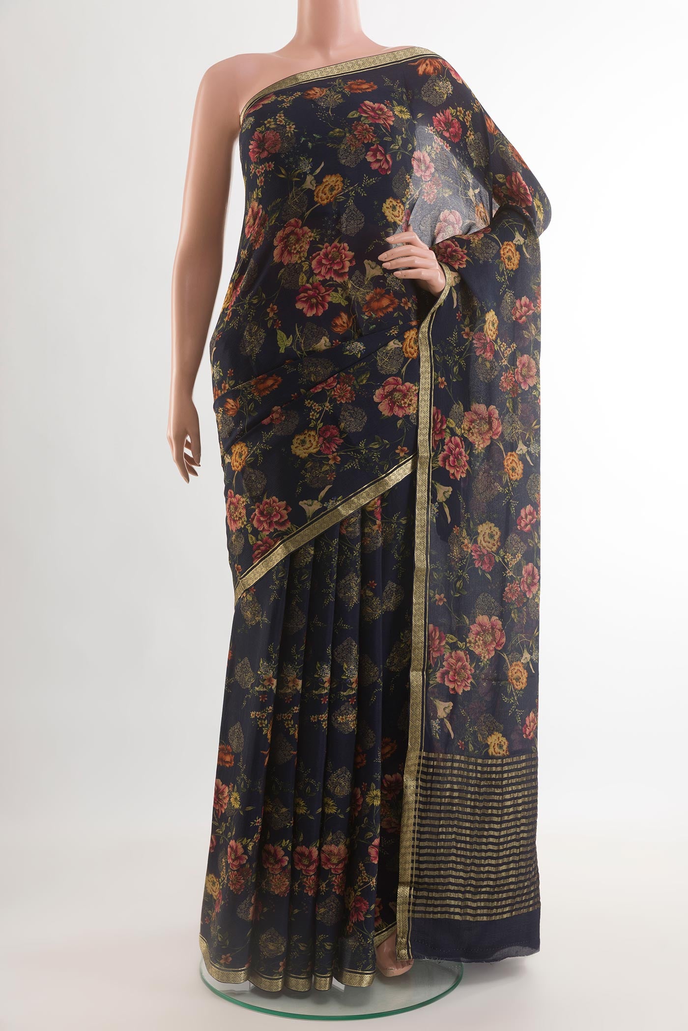 Navy Blue Mysore Chiffon Saree with Floral Print on the body and Zari Border.  displayed on a mannequin