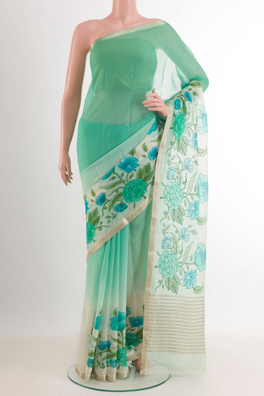 Green Mysore Chiffon Saree with Printed design on the body and Zari Border.  displayed on a mannequin