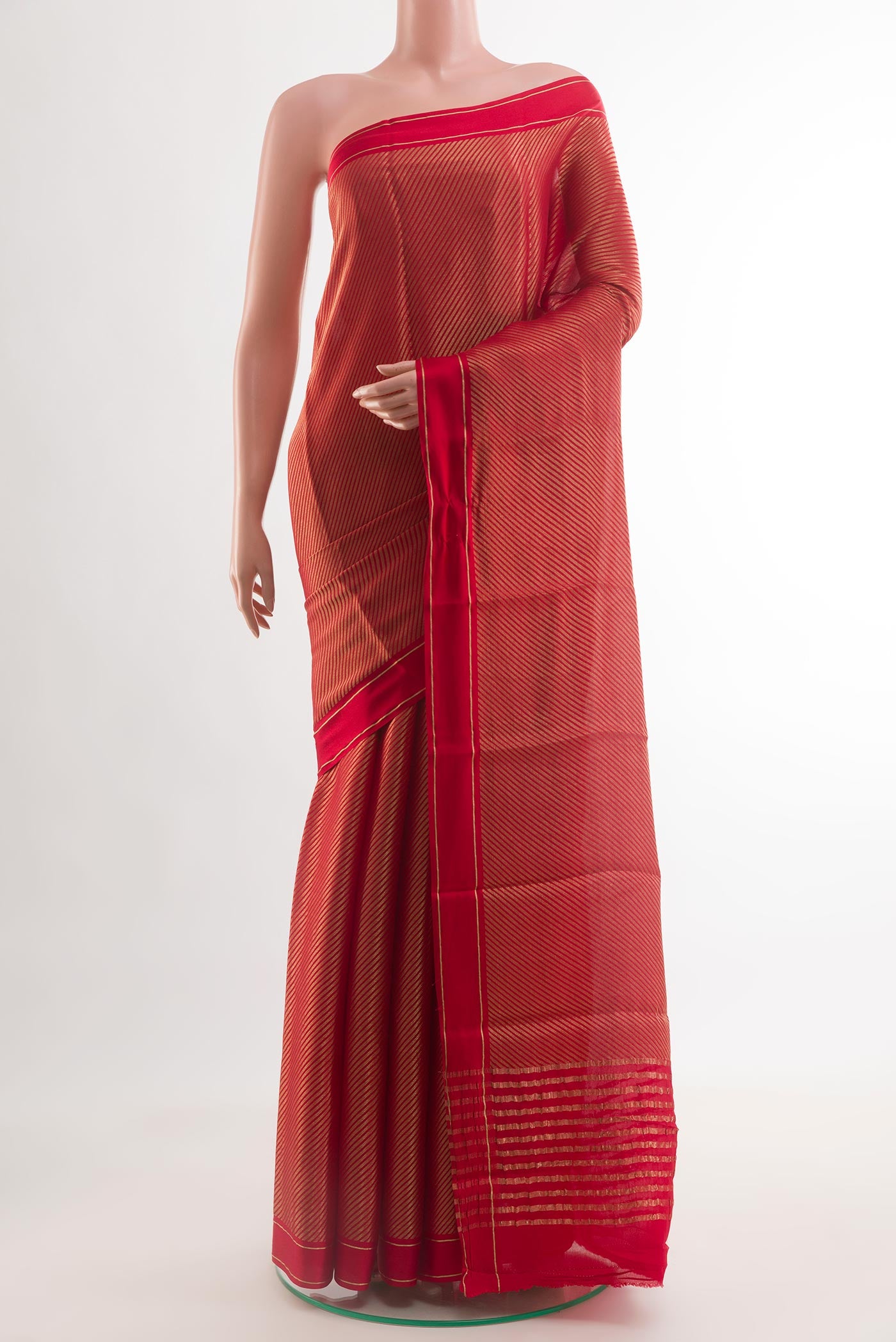 Red Mysore Crepe Saree with Stripes on the body and Zari Border.  displayed on a mannequin