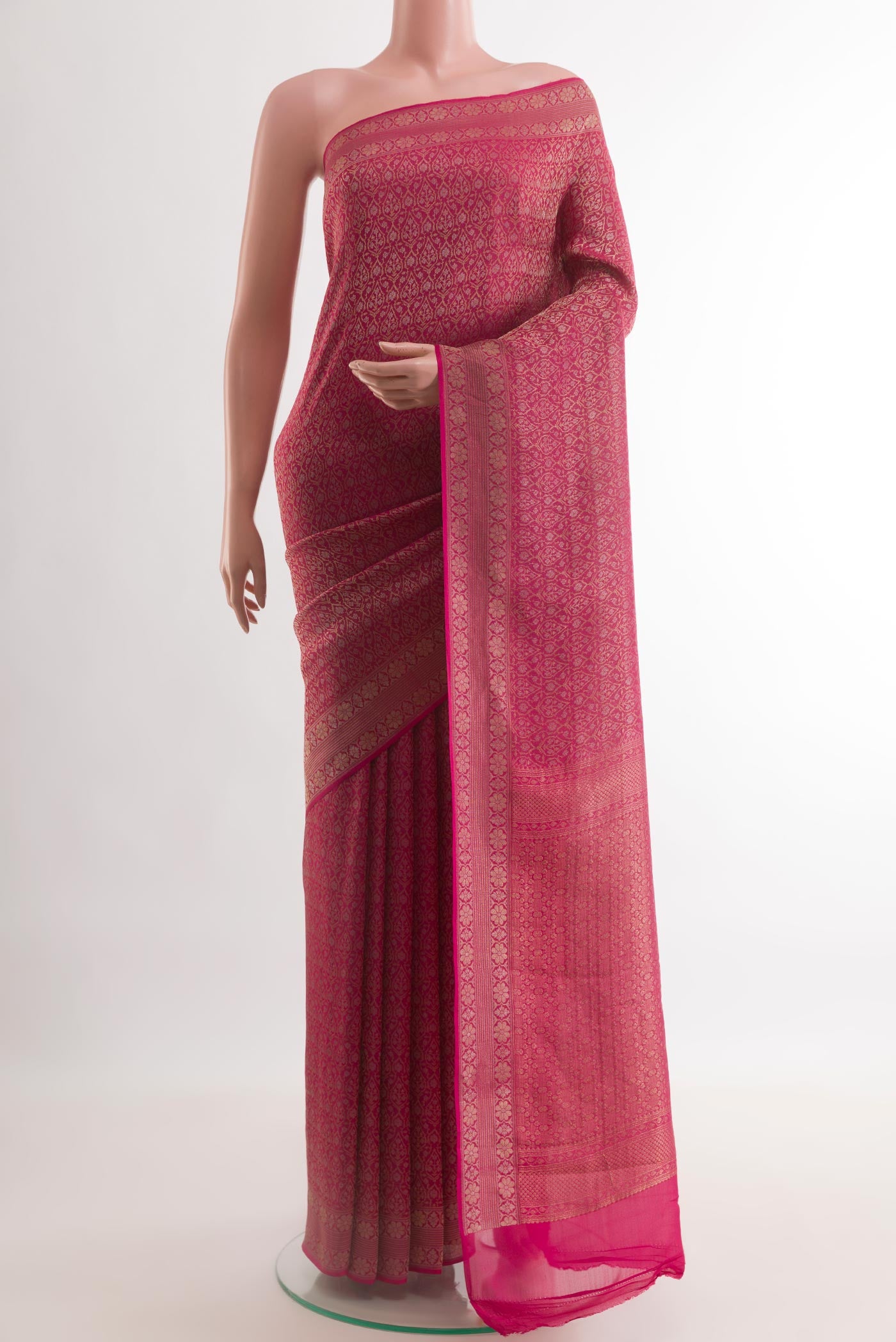 Dark Pink Mysore Crepe Saree with Zari Brocade on the body and Zari Border.  displayed on a mannequin