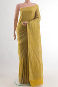Pure Silk Mustard Mysore Crepe Saree with Zari Brocade on the body and Zari Border.  displayed on a mannequin