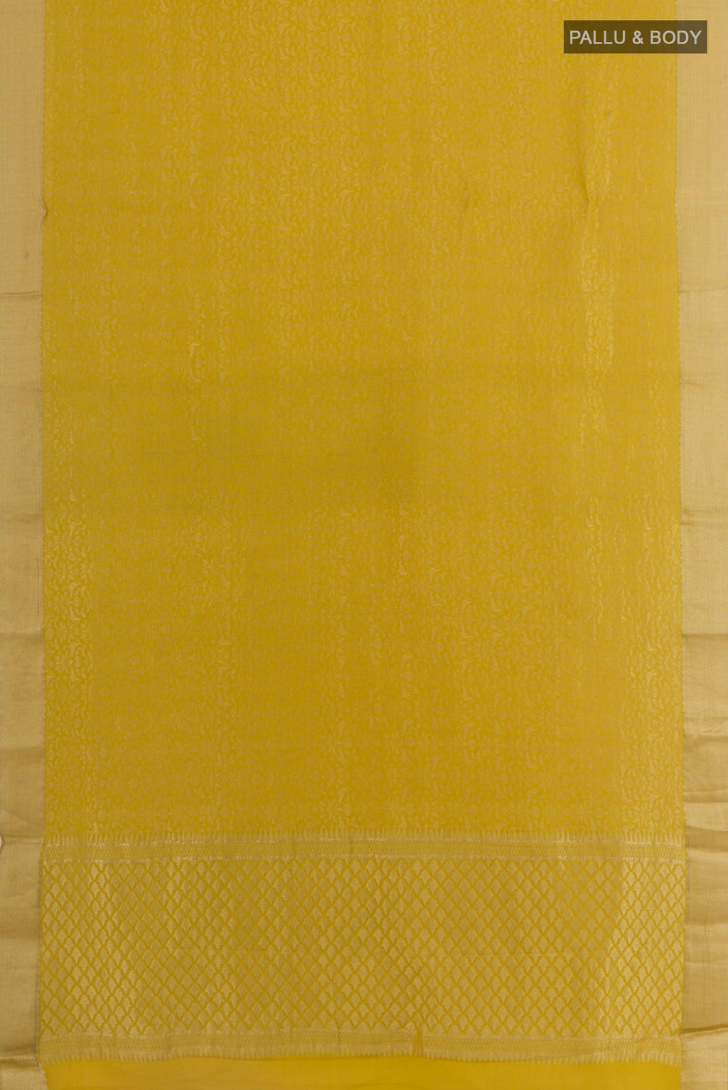 Flat view of Mustard Mysore Crepe Saree with Zari Brocade on the body and Zari Border. 