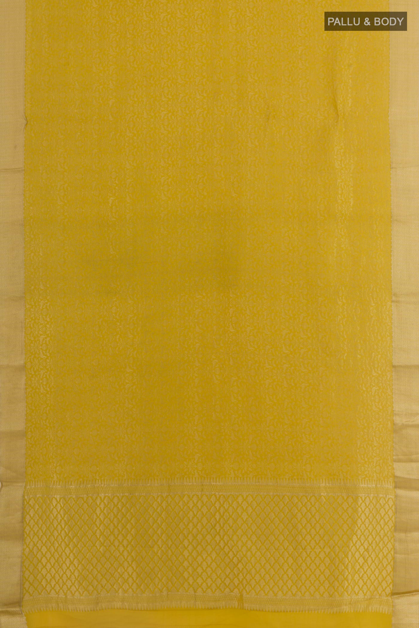 Flat view of Mustard Mysore Crepe Saree with Zari Brocade on the body and Zari Border. 