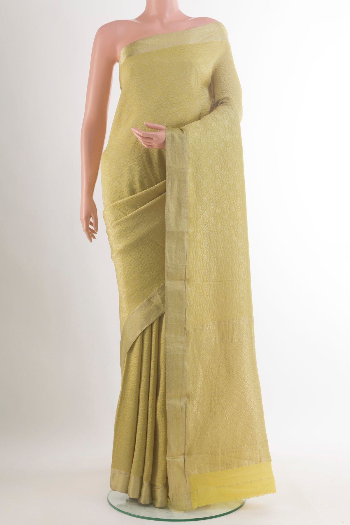 Yellow Mysore Crepe Saree with Zari Brocade on the body and Zari Border.  displayed on a mannequin