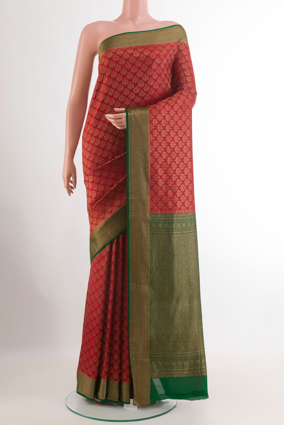 Red Mysore Crepe Saree with Zari Butta on the body and Zari Border.  displayed on a mannequin