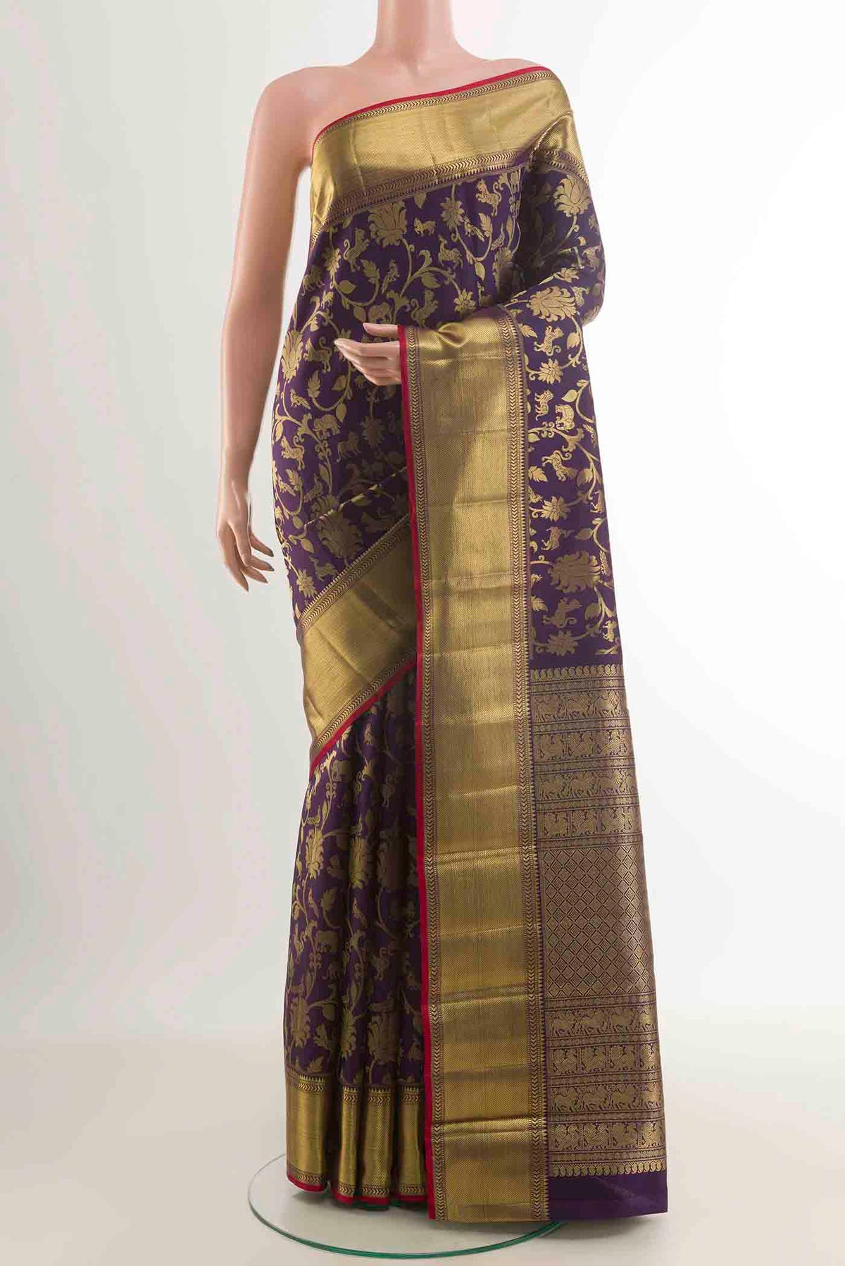 Pure Silk Pure Zari Purple Kanchipuram Saree with Zari Brocade on the body and Zari Border displayed on a mannequin