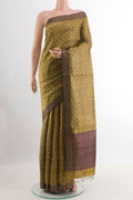 Yellow Tussar Saree with Printed design on the body and Zari Border.  displayed on a mannequin