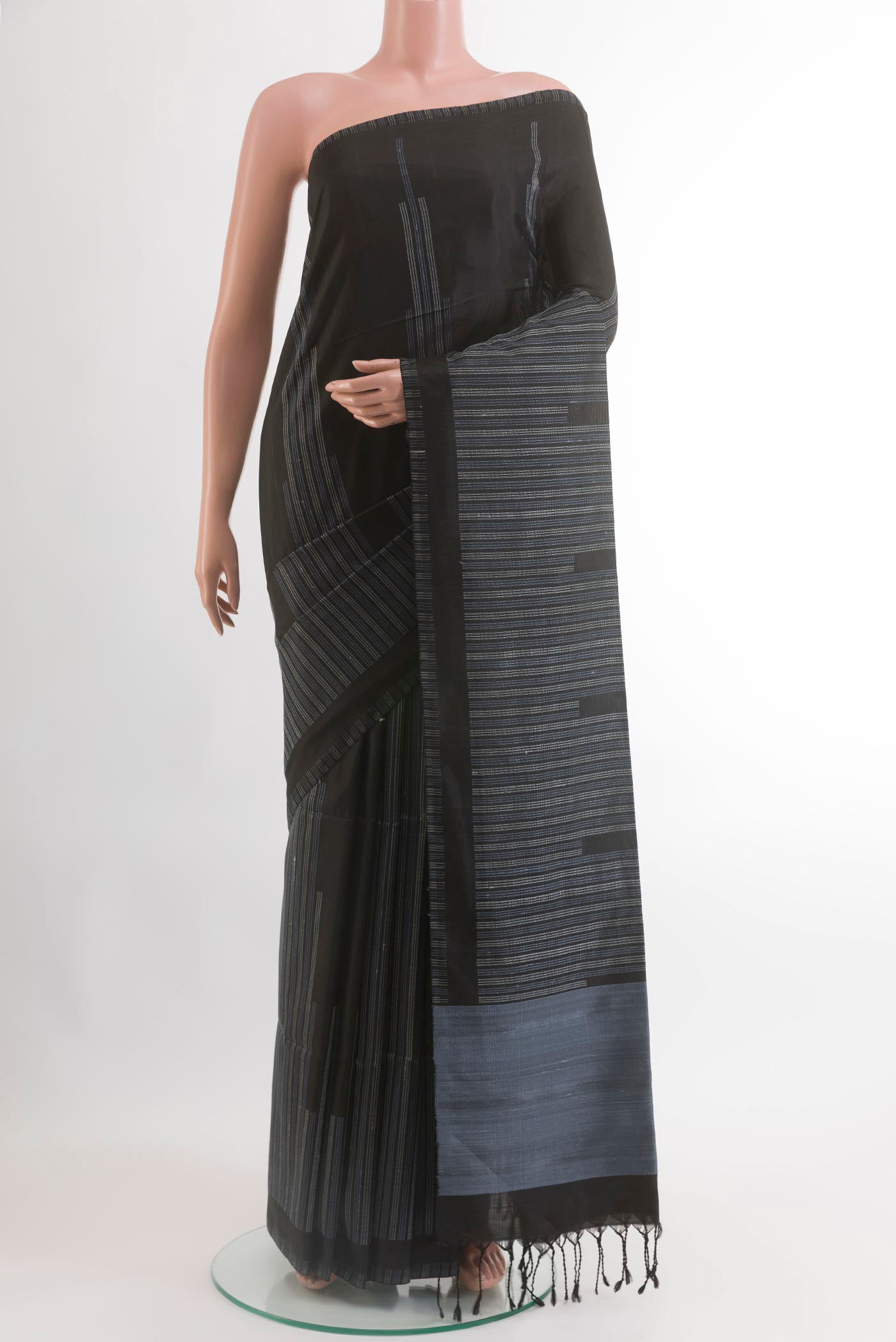 Black Soft Silk Saree with Fancy on the body and Without Border.  displayed on a mannequin