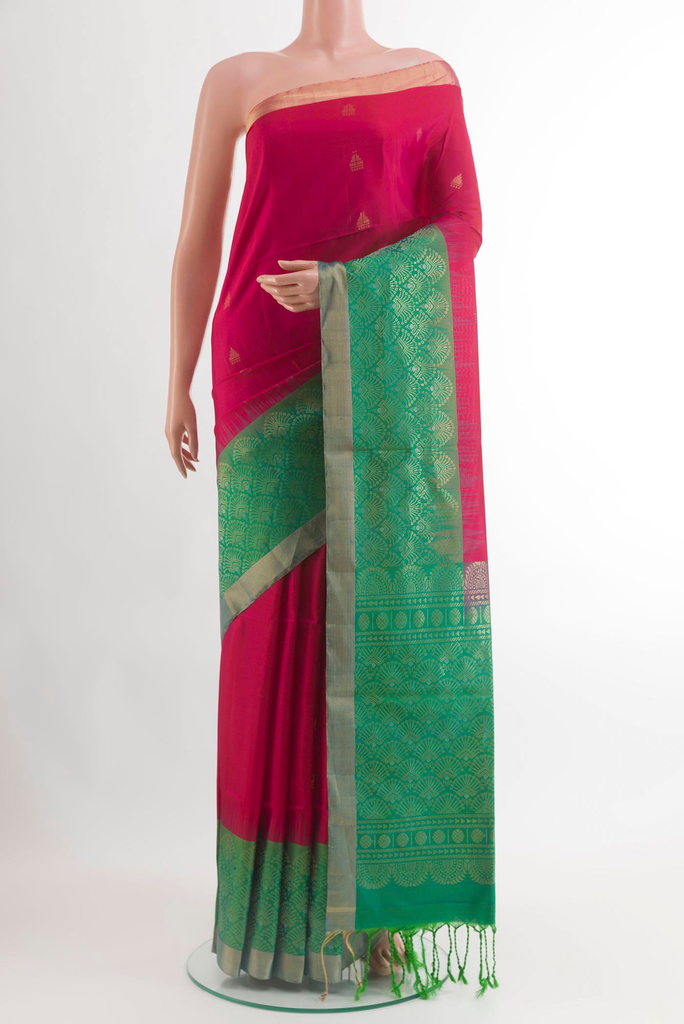 Rani Pink Soft Silk Saree with Zari Butta on the body and Zari Border.  displayed on a mannequin