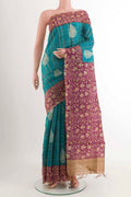 Blue Tussar Saree with Checked design on the body and Zari Border displayed on a mannequin