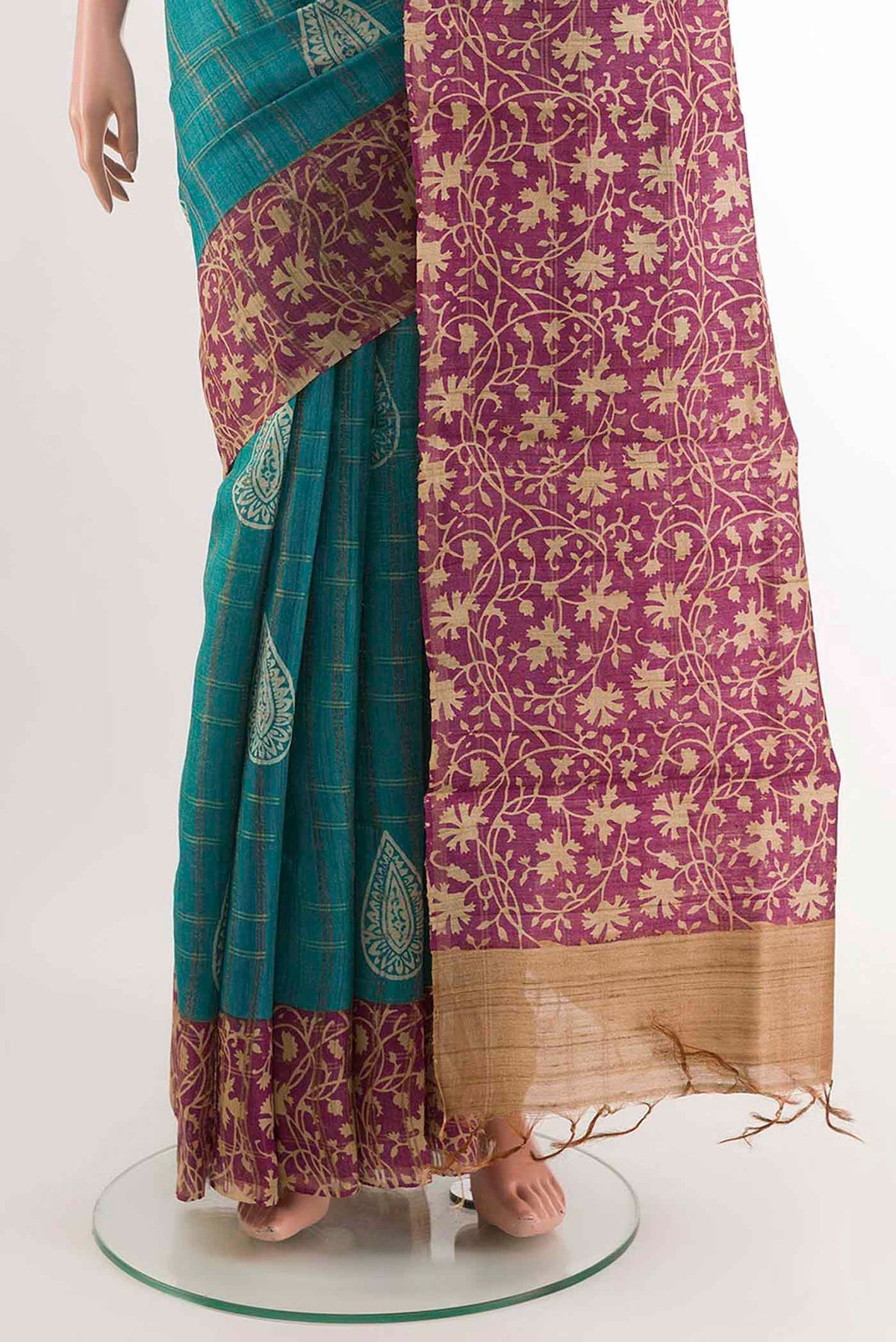 Pleats and pallu of Blue Tussar Saree with Checked design on the body and Zari Border
