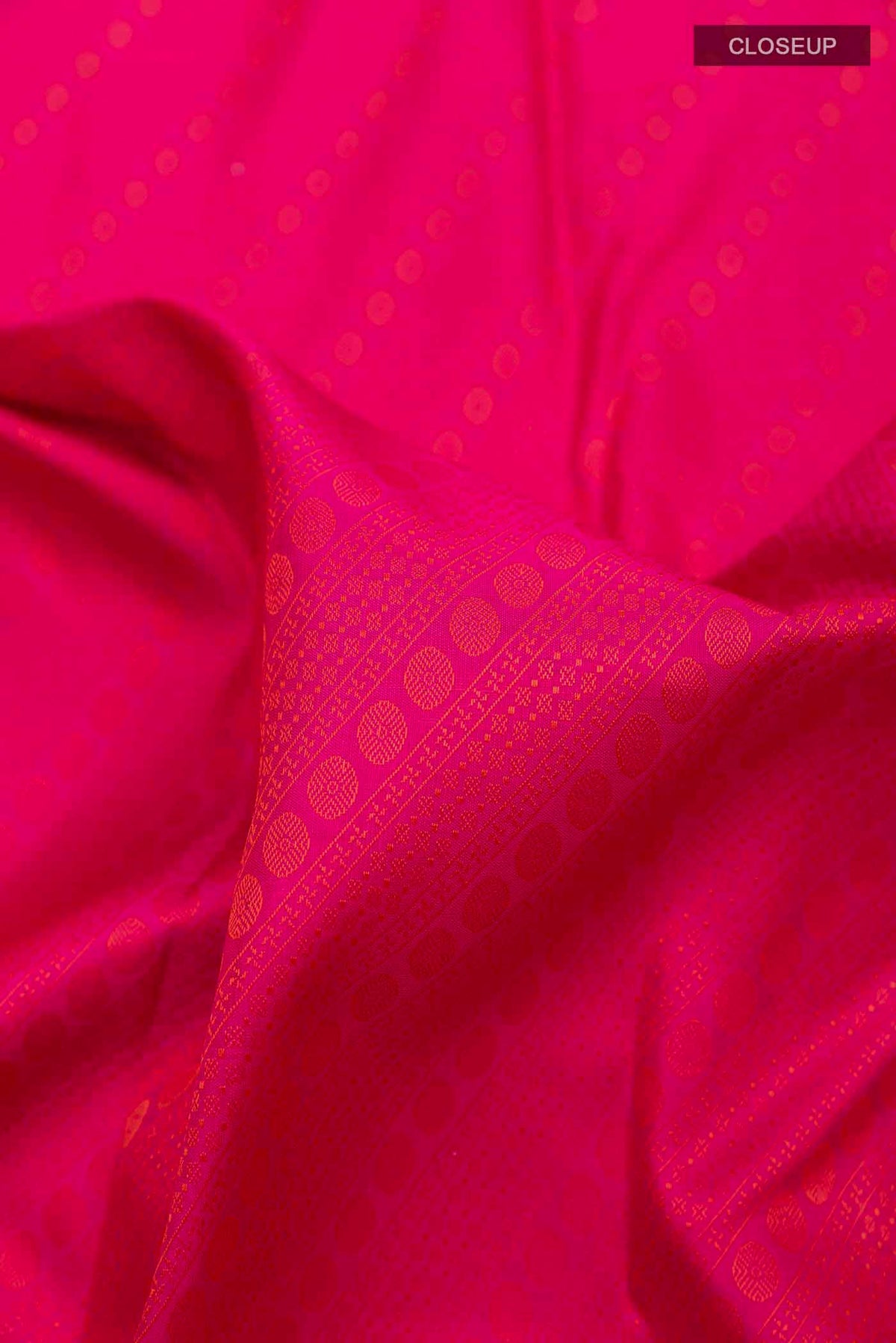 Close up of Pink Dual Tone Kanchipuram Silk Saree with Jacquard design on the body and Zari Border displaying folds