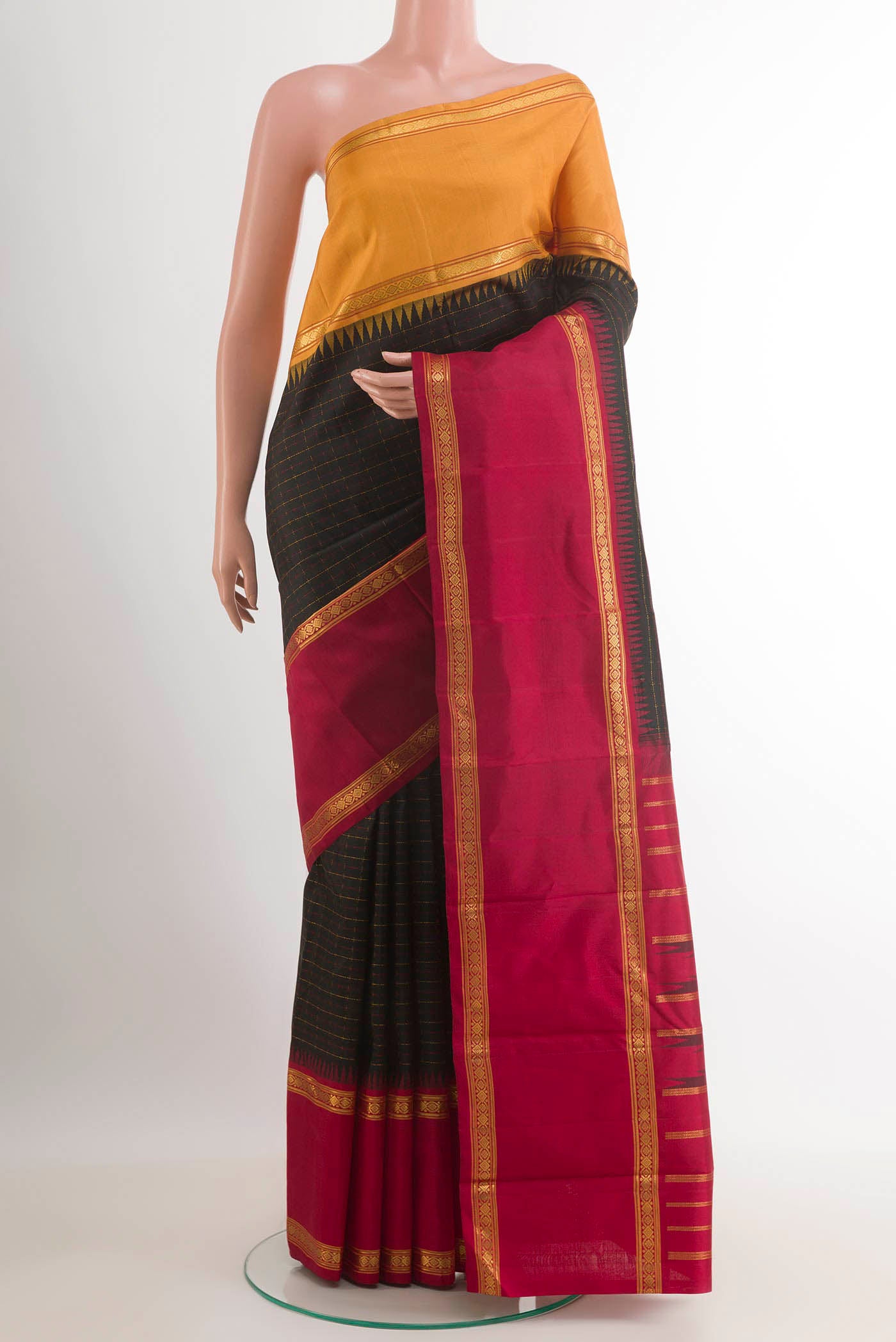 Black Kanjivaram Silk Saree with Checked design on the body and Ganga Jamuna Border.  displayed on a mannequin