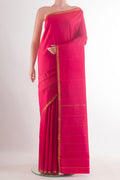 Pure Silk Pink Kanjivaram Saree with Plain Body and Zari Border.  displayed on a mannequin
