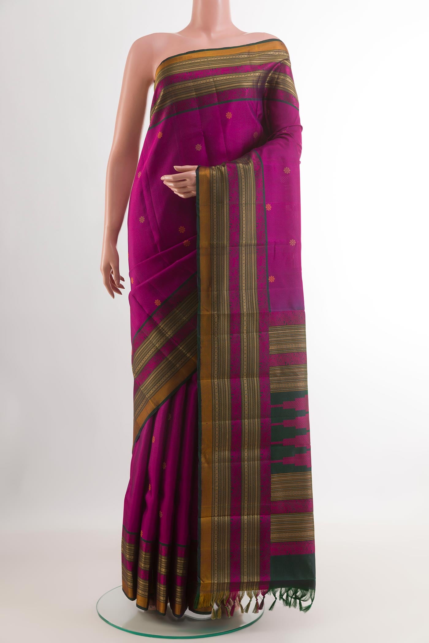 Purple Kanchipuram Silk Saree with Thread Butta on the body and Zari Border.  displayed on a mannequin