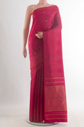 Pure Silk Maroon Kanjivaram Saree with Zari Butta on the body and Zari Border.  displayed on a mannequin