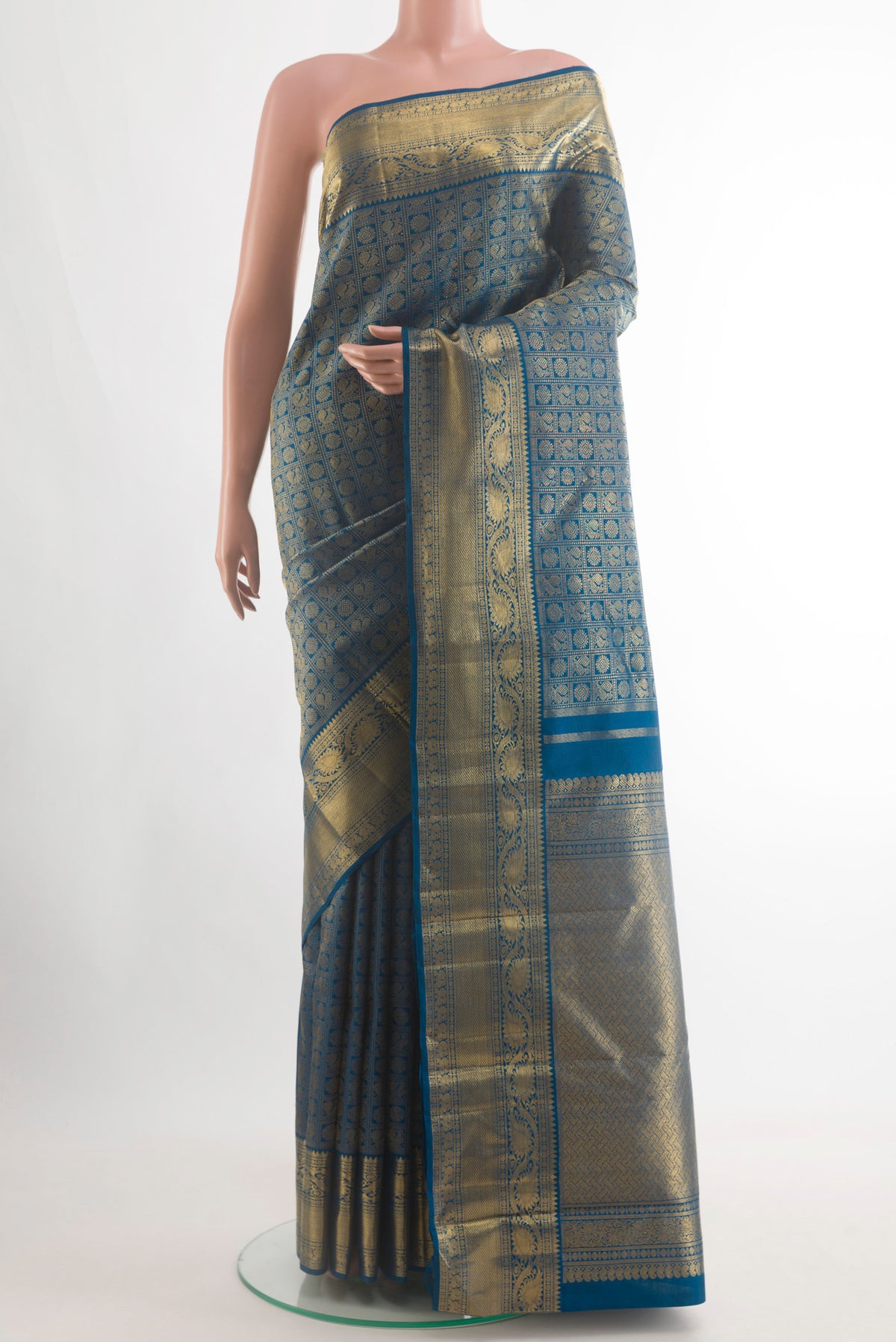 Pure Silk Pure Zari Blue Kanjivaram Saree with Zari Brocade on the body and Zari Border.  displayed on a mannequin