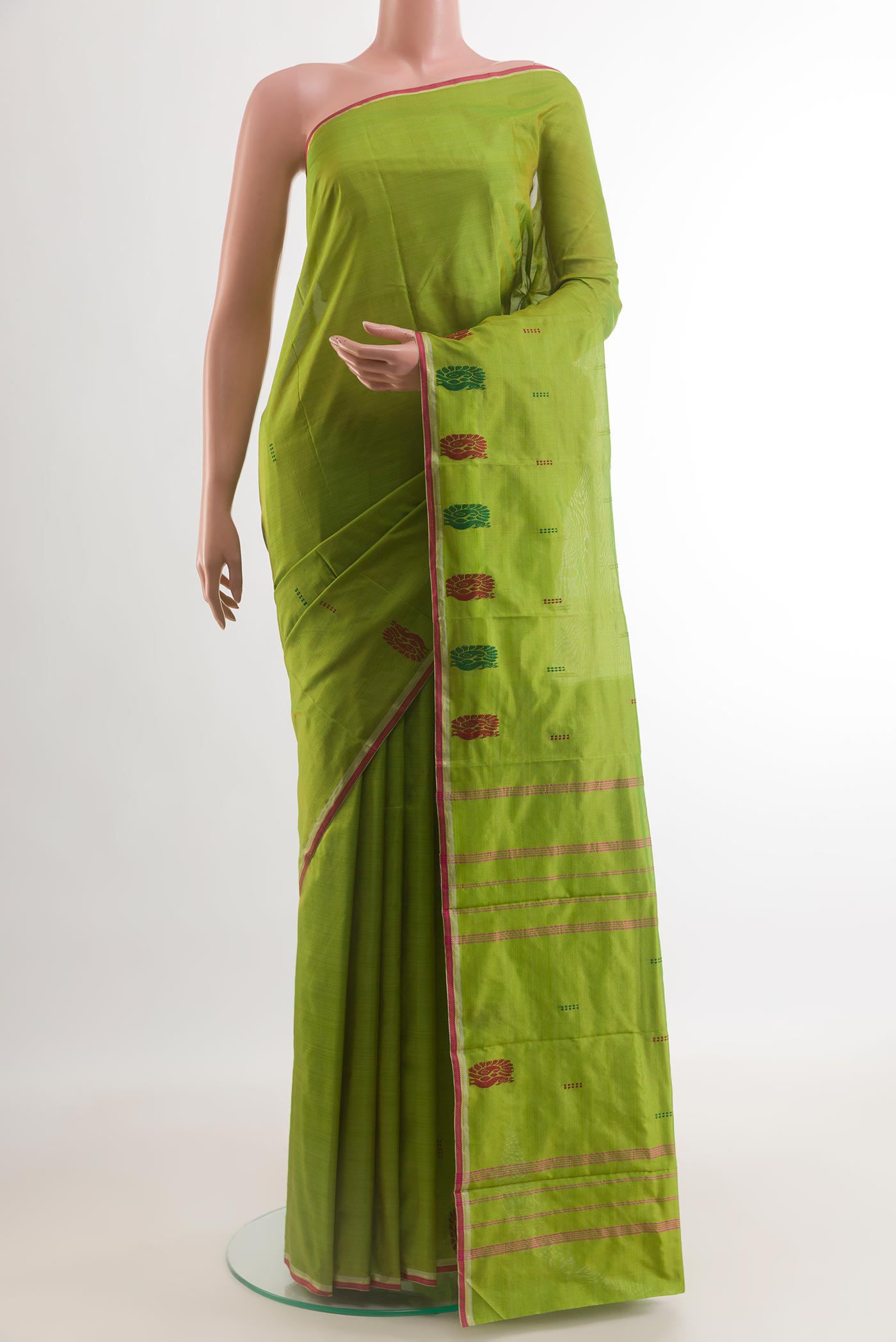 Green Kanchipuram Silk Saree with Thread Butta on the body and Thread Border.  displayed on a mannequin