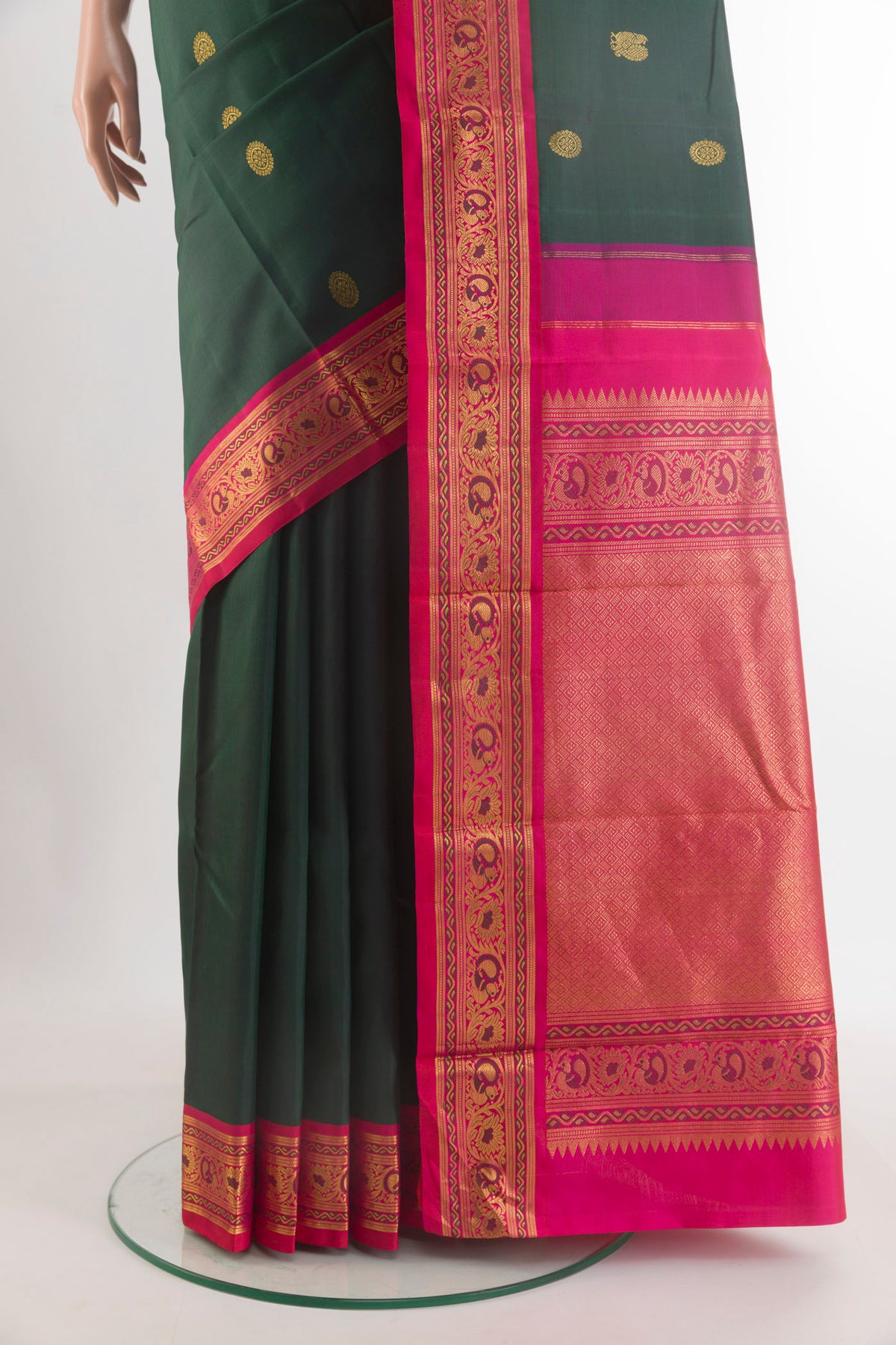 Pleats and pallu of Pure Silk Bottle Green Kanjivaram Saree with Zari Butta on the body and Zari Border. 