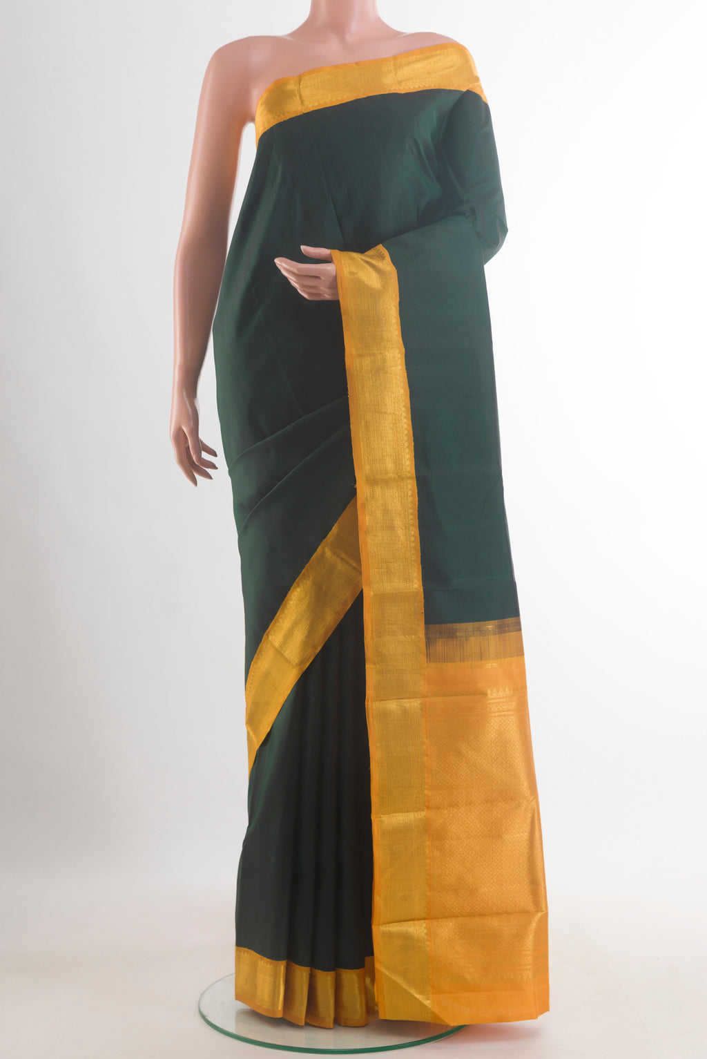 Pure Silk Bottle Green Kanchipuram Saree with Plain Body and Zari Border.  displayed on a mannequin
