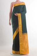 Pure Silk Bottle Green Kanchipuram Saree with Plain Body and Zari Border.  displayed on a mannequin