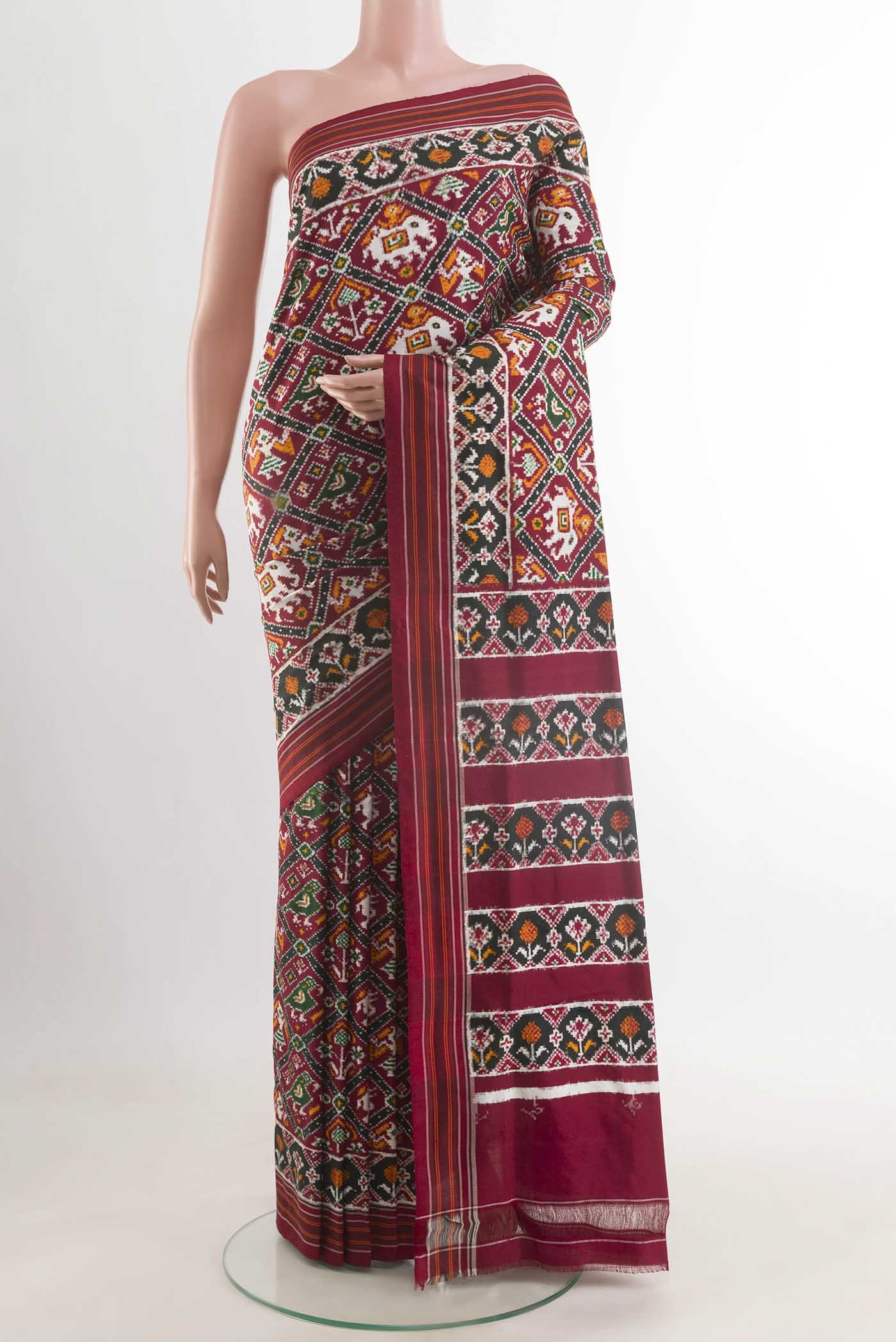 Maroon Pochampally Silk Saree with Pure Ikat on the body and Ikat Border displayed on a mannequin