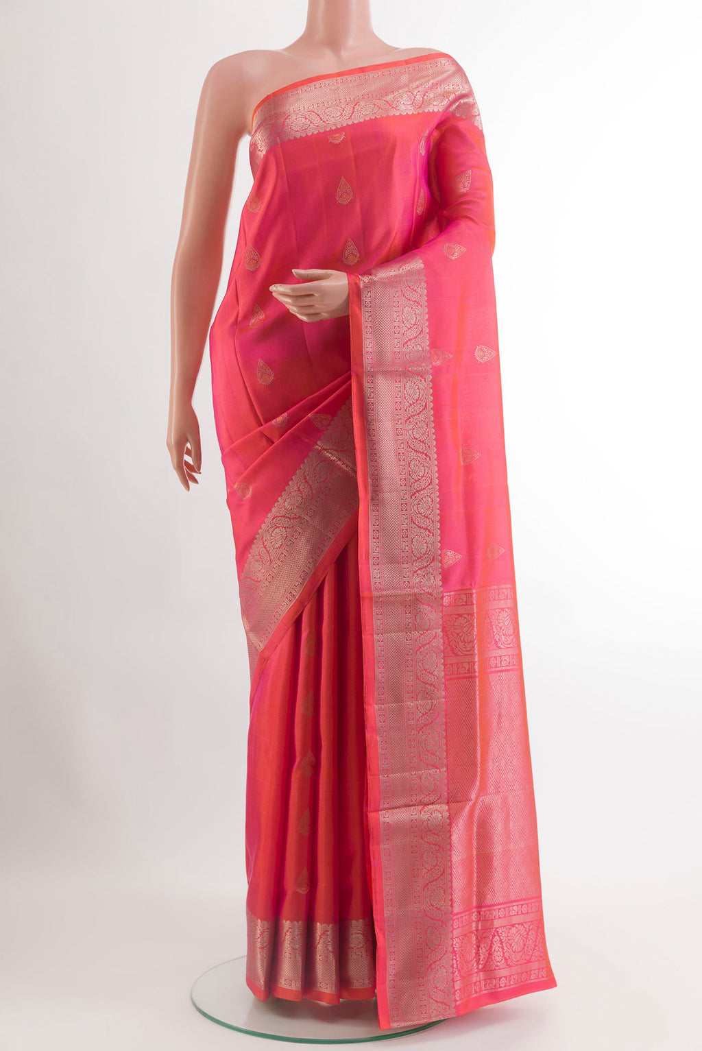 Pink Soft Silk Saree with Zari Butta on the body and Zari Border.  displayed on a mannequin