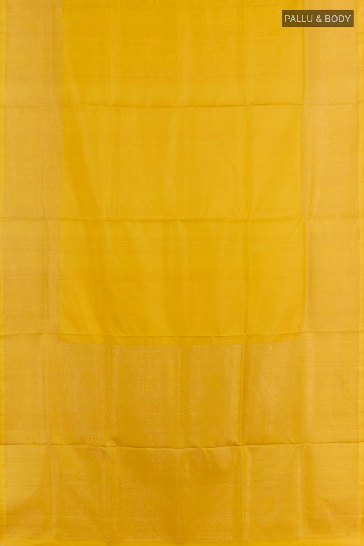 Flat view of Yellow Soft Silk Saree with Plain Body and Zari Border. 