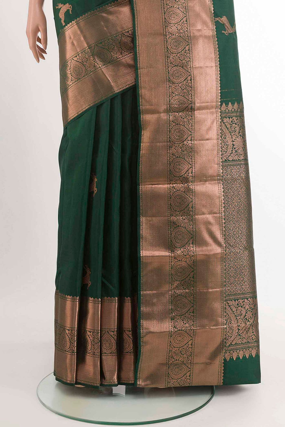 Pleats and pallu of Green Kanchipuram Silk Saree with Zari Butta on the body and Zari Border