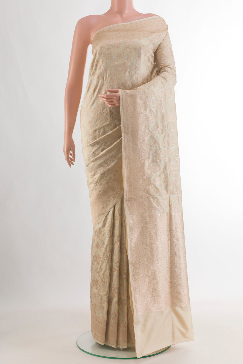 Pure Silk Off White Banarasi Saree with Zari Brocade on the body and Zari Border.  displayed on a mannequin