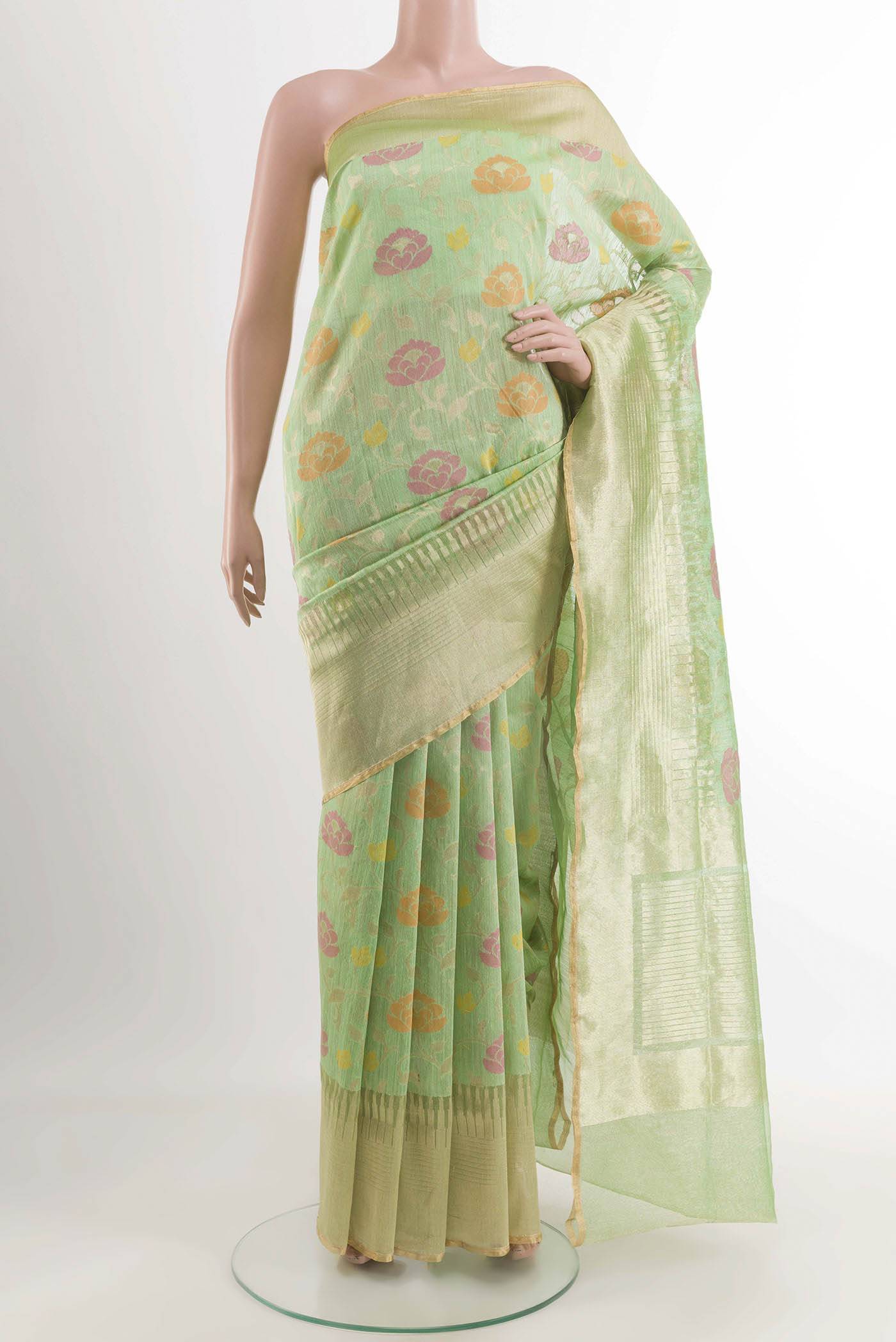 Green Banarasi Kora Silk Saree with Thread Brocade on the body and Zari Border displayed on a mannequin