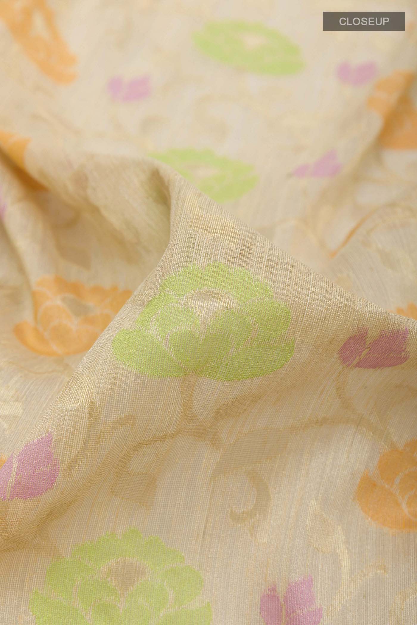 Close up of Beige Banarasi Kora Silk Saree with Thread Brocade on the body and Zari Border displaying folds