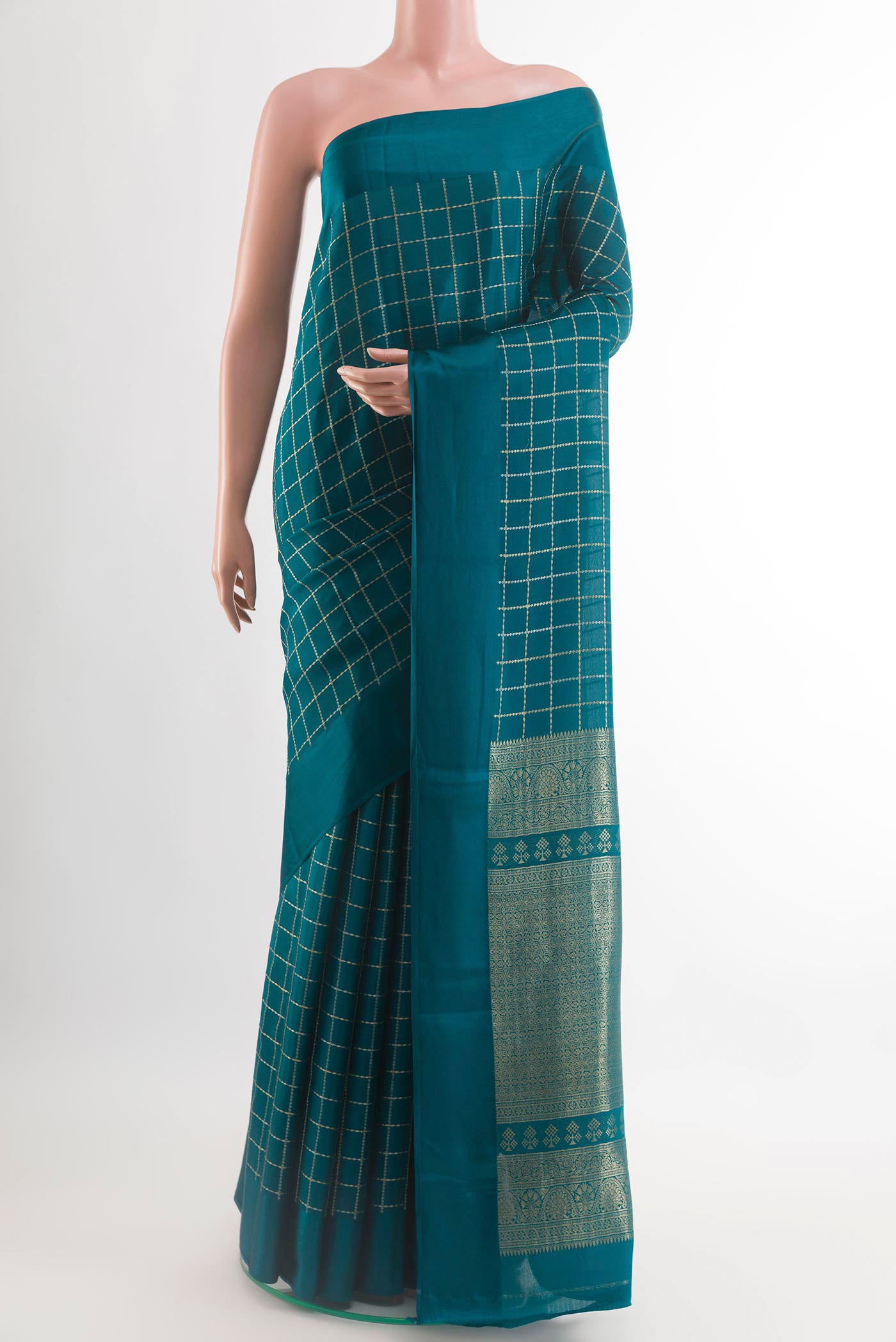 Teal Mysore Crepe Saree with Checked design on the body and Plain Border.  displayed on a mannequin