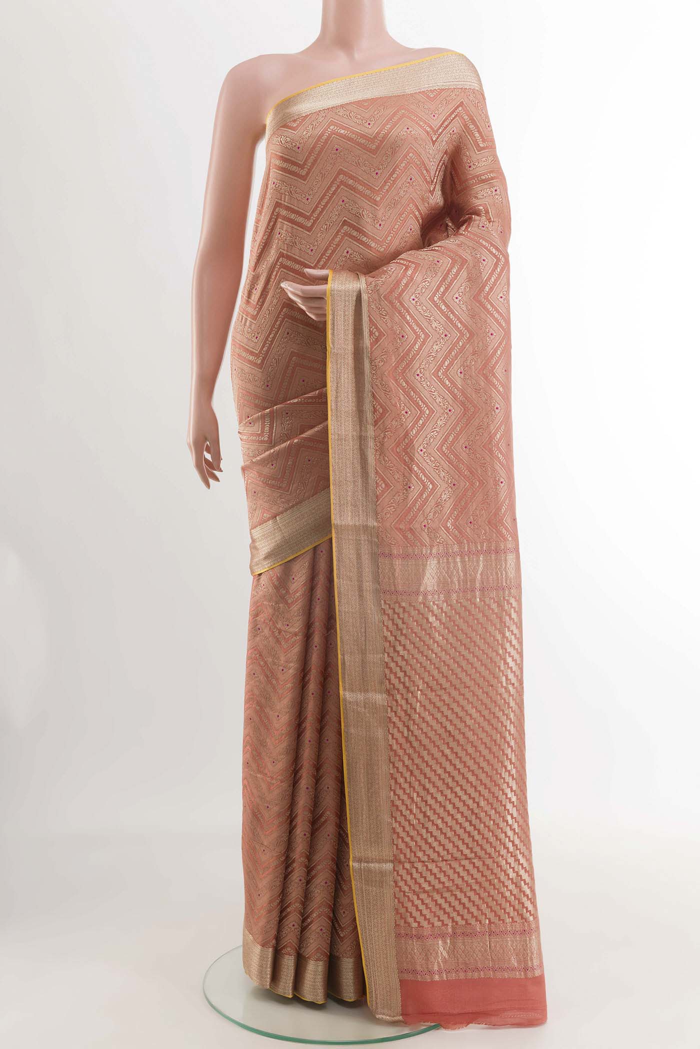 Peach Mysore Crepe Saree with Zari Brocade on the body and Zari Border displayed on a mannequin
